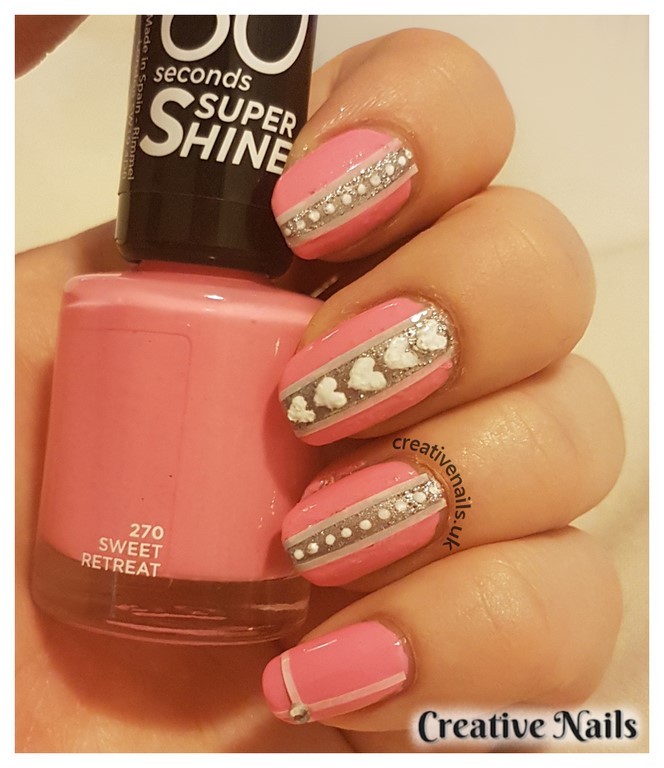 striped nails with dots and hearts
